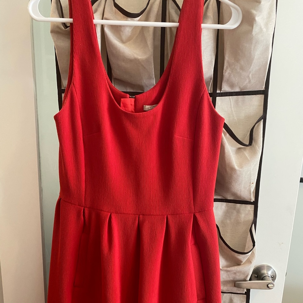 Knee length red dress.